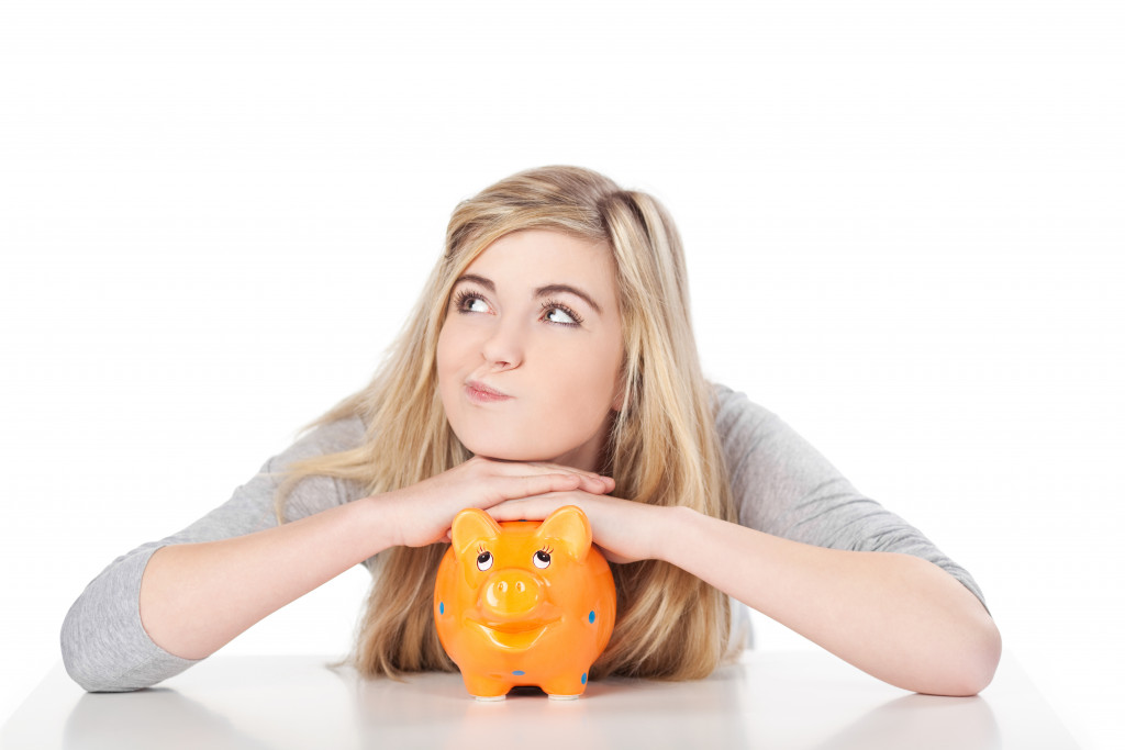 a woman with her piggy bank